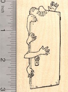 a rubber stamp with an image of a hand reaching for a door handle on it