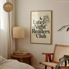 a bed room with a neatly made bed and a poster on the wall above it