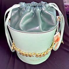 Anna Paola Two-Tone Italian Leather Green Bucket Bag Cinch Bag Gold Chain Nwt Style: Morena Outer Is Light Sage Green, Inner Leather Liner Deeper Succulent Green. Gold Chain Details. Detachable Hand Strap And Shoulder Strap Included. Dust Bag Included. Drawstring With Gold Tips. 10" (W) X 8" (H) X 6" (D) Gorgeous Pebble Leather On Outside And Supple Smooth Leather On Inside. Black Satin Lining. Trendy Bucket Bag With Gold-tone Hardware, Bucket Bag With Chain Strap, Bucket Shoulder Bag With Chain Strap, Chain Strap Bucket Shoulder Bag, Everyday Crossbody Bucket Bag With Chain Strap, Fashion Accessory Bucket Bag With Detachable Strap, Everyday Bucket Shoulder Bag With Chain Strap, Chic Crossbody Bucket Bag, Trendy Bucket Bag With Chain Strap