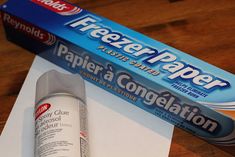 a tube of paper next to a box of toothpaste