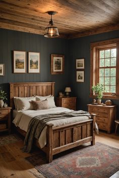 a bed room with a neatly made bed and wooden furniture on the hardwood flooring