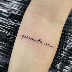 a small tattoo with the word november on it