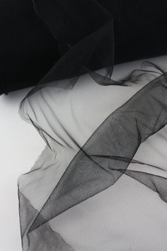 black sheer fabric on top of a white surface