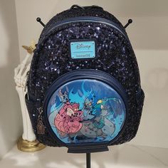 Loungefly Disney Hercules Hades Snow Globe Sequin Mini Backpack Time To Take Over Olympus? Pack Your Essentials Into This Sparkly Mini Backpack! From Hercules, This Backpack Has Navy Sequins All Over And Features A Front Pocket Designed Like A Snow Globe Filled With Confetti And Starring Hades, Pain And Panic In The Center. Comes With A Hades Front Zipper Charm, Side Pockets And An Interior Drop Pocket. 8" X 4 1/2" X 10 1/2" Polyurethane Front Zipper Charm Interior Drop Pocket Side Pockets Impor Disney Hades, Pain And Panic, Disney Hercules, Loungefly Disney, Zipper Charms, Sequin Mini, Snow Globe, Disney Villains, Mini Backpack