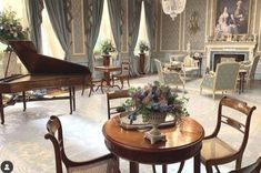 a living room filled with furniture and a grand piano