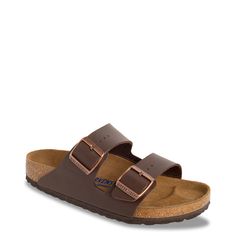 Metallic buckle detailing and bold straps freshen the look and feel of these men's Birkenstock Arizona Soft Footbed dark brown slide sandals. Made of durable leather upper, these slides have a round open toe, easy slip-on entry, and two straps, each with an individually adjustable metal pin buckle for a precise fit. Features include a soft a footbed made of cork with natural suede leather top cover to offer plush comfort all through the day, and a lightweight EVA traction outsole with patterned tread. | Birkenstock Men's Arizona Soft Footbed Slide Sandal in Dark Brown Leather Size EU 42/US 9-9. 5 Medium Men Birkenstock, Birkenstock Men, Birkenstock Sandals, Birkenstock Arizona, Birkenstock Shoes, Dark Brown Leather, Leather Top, Slide Sandals, Suede Leather