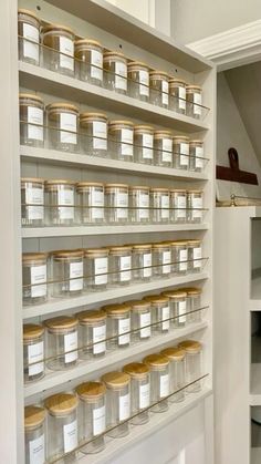 the shelves are filled with jars and containers