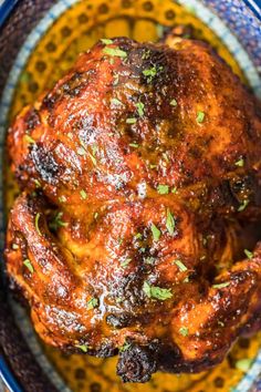 a close up of a cooked chicken in a bowl