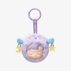 a purple stuffed animal keychain with stars and moon decorations on the front, hanging from a hook