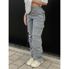 Looking for a stylish and comfortable pair of pants to wear while you're out on a date or having fun outings with friends? Look no further than our Vintage Cargo Pants For Women! Made from a high-quality blend of cotton and polyester. They come in a stylish high street pattern, with a loose waist and full leg length. They also come with a button, pockets, and fake zippers, making them the perfect choice for all-day wear. Specifications: Style: High Street Waist Type: HIGH Decoration: Button, Poc Trendy Cotton Parachute Pants, Trendy Cotton Straight Leg Cargo Pants, Trendy Cotton Parachute Pants With Multiple Pockets, Trendy Cotton Bottoms With Multiple Pockets, Trendy Cotton Pants With Multiple Pockets, Trendy Cotton Pants With Side Pockets, Trendy Gray Cotton Bottoms, Trendy Cotton Cargo Style Bottoms, Spring Gray Straight Leg Cargo Pants