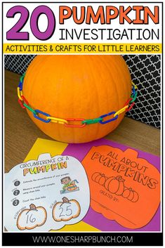 an orange pumpkin sitting on top of a table next to some writing paper and stickers