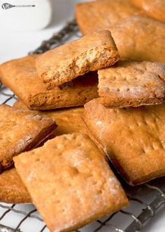 a bunch of cookies that are on a cooling rack