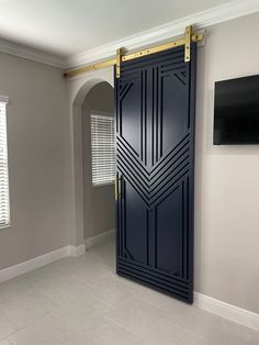 an empty room with a large blue door