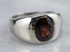 The ultimate 'go with anything' ring, this vintage mounting is low to the hand and has a sleek unisex design, making it comfortable to wear day or night! The polished bezel and inset setting protect the deep, wine-red garnet set in the center.Metal: 14K White GoldGem: Garnet 2.41 CaratsGem Measurements: 9.4 x 7.5 mm, OvalRing Size: 8Marks: “14K” Stamped on the inside band Formal Garnet Ring With Polished Finish, Formal Garnet Jewelry With Bezel Setting, Classic Garnet Rings With Bezel Setting, Modern Ruby Ring With Bezel Setting For Formal Occasions, Classic Garnet Signet Ring For Formal Occasions, Classic Garnet Signet Ring For Anniversary, Formal Garnet Signet Ring, Classic Garnet Jewelry With Polished Finish, Modern Garnet Rings For Formal Occasions