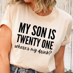 "This 21st birthday shirt makes a totally unique shirt for mom to wear on her son's 21st birthday! If your son's turning 21, this is the perfect tee to welcome in \"the big two one\" with joy and laughter! Grab this tee today while it's on sale! Delivery Times: ◦ Production: 1 business day on average (maximum: 5) ◦ Shipping: 2 business days on average (maximum: 5) Unisex Fit: ◦ Extra soft, preshrunk unisex t-shirt ◦ Women: Semi-fitted, laidback, rollable, & tuckable ◦ Men: Fitted on upper body & loose around the belly ☞ Size up for a looser fit Soft Materials: ◦ Super soft, preshrunk tee with eco-friendly materials ◦ Black, White, & Navy: 100% soft ring spun cotton ◦ Heather Navy: 65% polyester & 35% cotton ◦ Sport Grey: 90% cotton & 10% polyester" 21st Birthday Tshirts, Drink Birthday, 21st Birthday Shirt, 21st Birthday Shirts, Turning 21, 21st Birthday Gifts, Birthday Tshirts, 21st Gifts, Unique Shirt