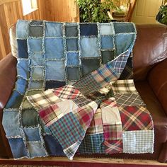 a patchwork blanket sitting on top of a couch