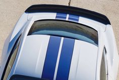 an overhead view of a blue and white sports car