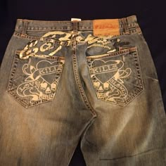 Ed Hardy Jeans 100% Cotton Love Kills Faded Front And Back. Few Ink Spots On Front. Has Rugged Feel And Look. Rock And Rival Jeans, Baggy Jean Designs, Fast And Furious Clothes, Christian Audigier Jeans, Thrift Y2k Clothes, Odd Clothes, Ed Hardy 2000s, Ed Hardy Clothes, Zumiez Pants