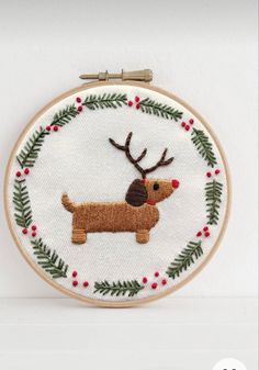 a cross stitch pattern with a dog on it