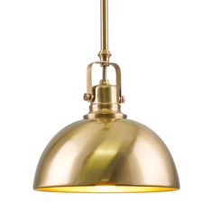 an antique brass pendant light with a white background