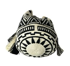 a black and white bag with tassels on the inside, sitting against a white background