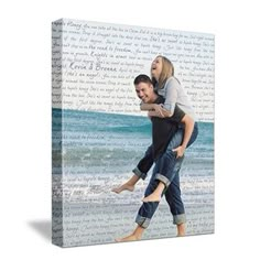 a man carrying a woman on his back in front of the ocean with words all over it