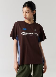 cotton-graphic-tee-cu321 Casual Brown Graphic T-shirt, Casual Brown T-shirt With Graphic Print, Sporty Brown Short Sleeve T-shirt, Trendy Brown Relaxed Fit T-shirt, Brown Cotton Tops With Logo Print, Brown Graphic Tee With Logo Print, Brown Relaxed Fit Tops With Text Print, Brown Cotton Tops With Graphic Print, Brown Cotton Top With Graphic Design