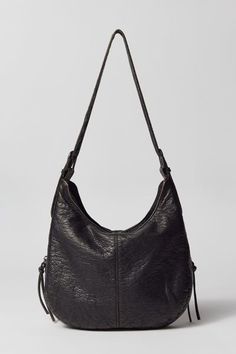 Silence + Noise utility washed shoulder bag. Tumble-washed soft faux leather bag in an everyday carry silhouette. Zippered top with tons of zip pockets at the front for all your essentials. Find it only at Urban Outfitters. Features Silence + Noise utility washed shoulder bag Zippered faux leather bag UO exclusive Content + Care PU Spot clean Imported Size Dimensions: 12.59" l x 2.75" w x 9.05" h Strap drop: 13.77" | Silence + Noise Utility Washed Shoulder Bag in Black, Women's at Urban Outfitte Urban Outfitters Bag, Faux Leather Bag, Black Leather Purse, Zipper Top, Everyday Carry, Leather Purses, Capsule Wardrobe, Leather Bag, Zip Pockets