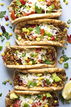 four pita bread tacos with minced beef and beans