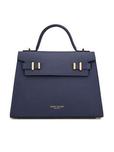 Introducing New Ava by Teddy Blake, Italy-crafted chic bag. Grained calf leather, single handle, flap closure, organized suede interior. Day-to-night elegance Made in Italy Italian Leather Handmade by Experts Formal Blue Flap Bag With Detachable Strap, Blue Top Handle Flap Bag For Formal Occasions, Classic Blue Formal Flap Bag, Blue Flap Bag With Gold-tone Hardware For Evening, Blue Evening Flap Bag With Gold-tone Hardware, Blue Top Handle Flap Bag For Evening, Evening Blue Top Handle Flap Bag, Modern Blue Flap Bag For Formal Occasions, Blue Evening Flap Bag