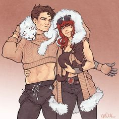 a man and woman are dressed up in winter clothes, one is holding a dog