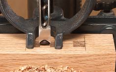 a piece of wood is being worked on by a machine that makes it easier to cut