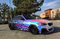 a colorful car parked in a parking lot