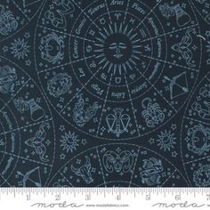 a black background with blue and white designs on the fabric, it is very dark