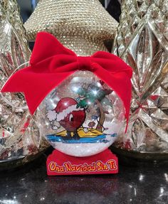 4 inch Snowglobe Ornament Bad bunny album Ornament Double side  Hope you love this Ornament made for a bad bunny fans. Perfect for this Christmas. A cute gift that will bring that bad bunny charm to your Christmas decoration. You can hand it as a snowglobe Ornament on your tree or stand it up. Has double side views. A perfect shaker and fun gift. Stalking Stuffers, Bad Bunny Christmas, Snowglobe Ornament, Snow Globe Ornament, Bunny Christmas, Tree Decor Christmas, Christmas Snow Globe, Globe Ornament, Christmas Snow Globes