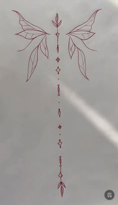 the cross is drawn with red ink on a white sheet that has arrows in it