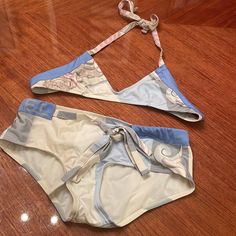 Chanel Bathing Suit In Cream , Light And Sky Blue Blue And Grey Colors . Ties Around The Neck And Also Has Tie On The Bottom. Top Measures 12” From Side To Side.The Bottom Measures 121/2” Also Side To Side. Maybe Worn One Time . Excellent Condition Chanel Bathing Suit, Chanel Swim, Chanel Blue, Blue And Grey, Bathing Suit, Blue Gray, Womens Swim, Sky Blue, 2 Piece