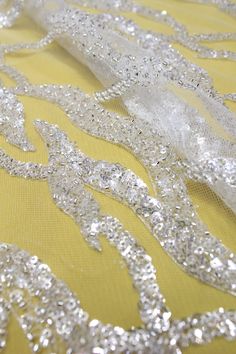 Welcome to Sunny shop. 1Yard Beads Lace Fabric For Bridal Dress, Veil Lace Fabric , Wedding Dress 3D Beaded Lace, Couture Tulle Sequins Lace Fabric, Mesh Lace This lace has an amazing look and is really very heavy. It is perfect the the most unique bridal dresses. Width about: 51inch (130Centimeters) Length : 91.44 Centimeters/ 1Yard Yarn: Transparent poly yarn Mesh: Nylon - off white Sequins: YES - Crystal Beads: YES - Silver Color: off-white+ Silver 30247# Price is set for one yard. You will r Glamorous White Wedding Dress For Reception, Wedding Lace Tulle Fabric With Rhinestones, Wedding Tulle Lace Fabric With Rhinestones, Glamorous Embellished White Wedding Dress, Glamorous Embellished Sequin Fabric For Wedding, Glamorous Sequined Tulle Fabric For Wedding, Glamorous Wedding Tulle Fabric With Sequins, White Beaded Wedding Dress For Party, White Glamorous Sequin Fabric With Rhinestones