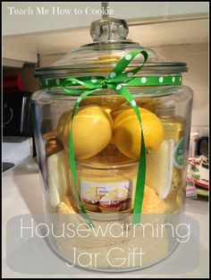 a glass jar filled with lemons and other items