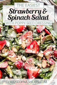 strawberry and spinach salad with poppy seed dressing in a white bowl on a table