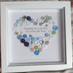 a white frame with buttons in the shape of a heart that says, friends don't a big thing it's a million little things