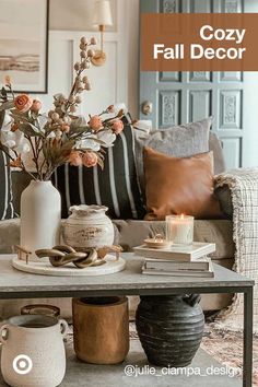 a living room filled with lots of furniture and flowers on top of a coffee table