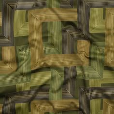 an image of a green and brown fabric with squares on it's side,