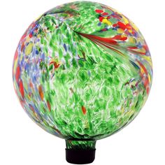 a colorful glass ball sitting on top of a black stand