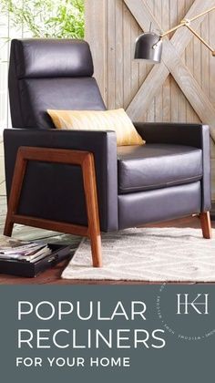 a recliner chair sitting on top of a rug in front of a wooden wall