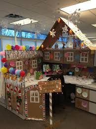 an office cubicle decorated with gingerbread houses