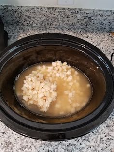 a bowl filled with rice sitting on top of a counter