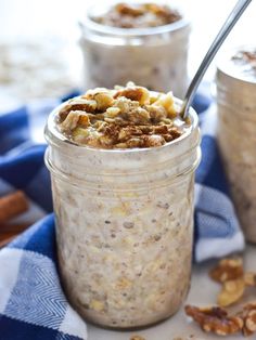 two jars filled with oatmeal sitting on top of a blue and white towel