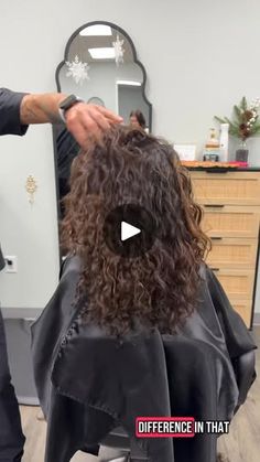 a man cutting another mans hair in a salon