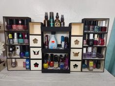 an assortment of nail polishes and manicures on display in a store shelf